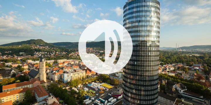 Stadtansicht von Jena mit einem darüber gelegten Lautsprechersymbol